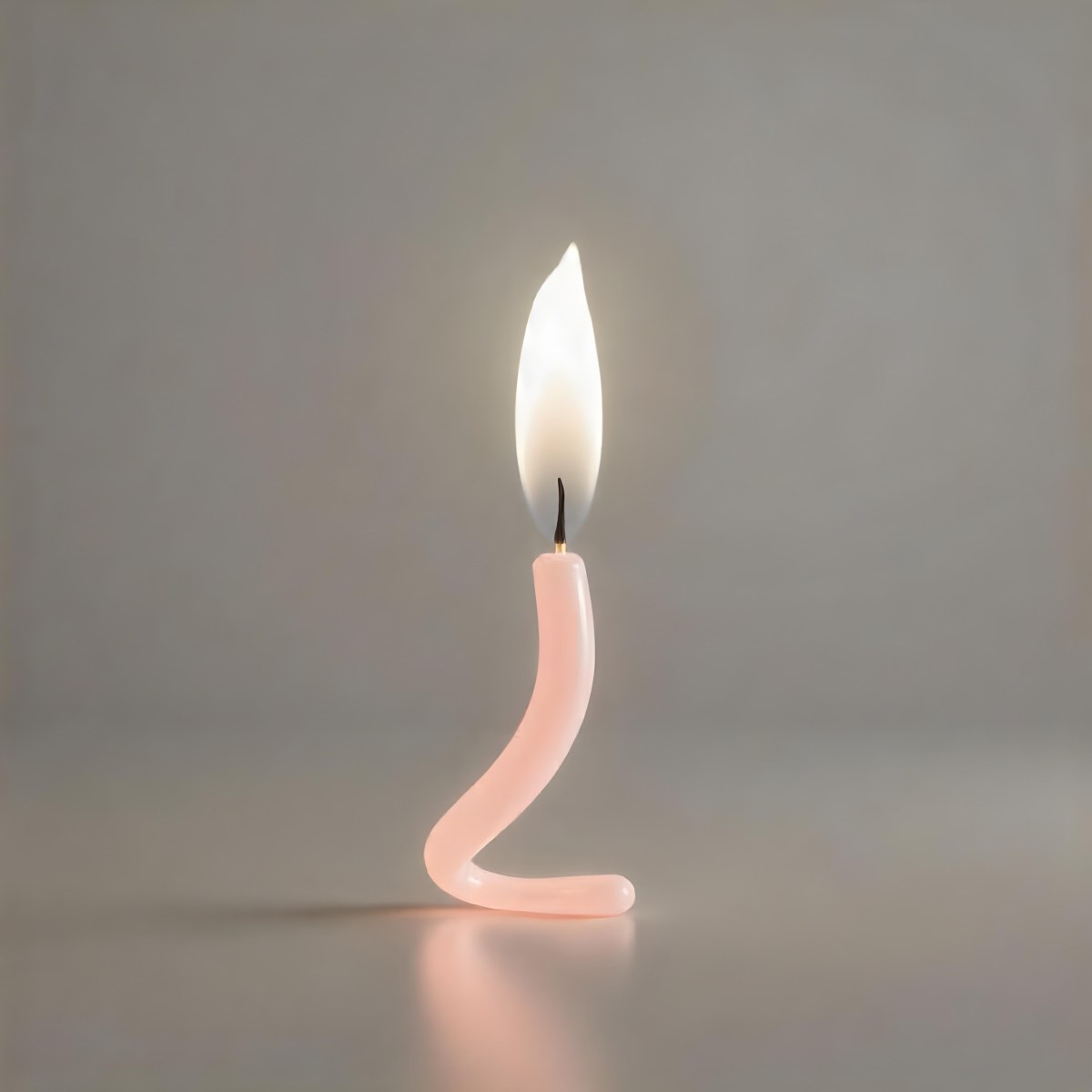 A Pink Spiral Candle With A Bright Flame On Top Casting A Bright Glow Simple Gray Background 11 Cca9