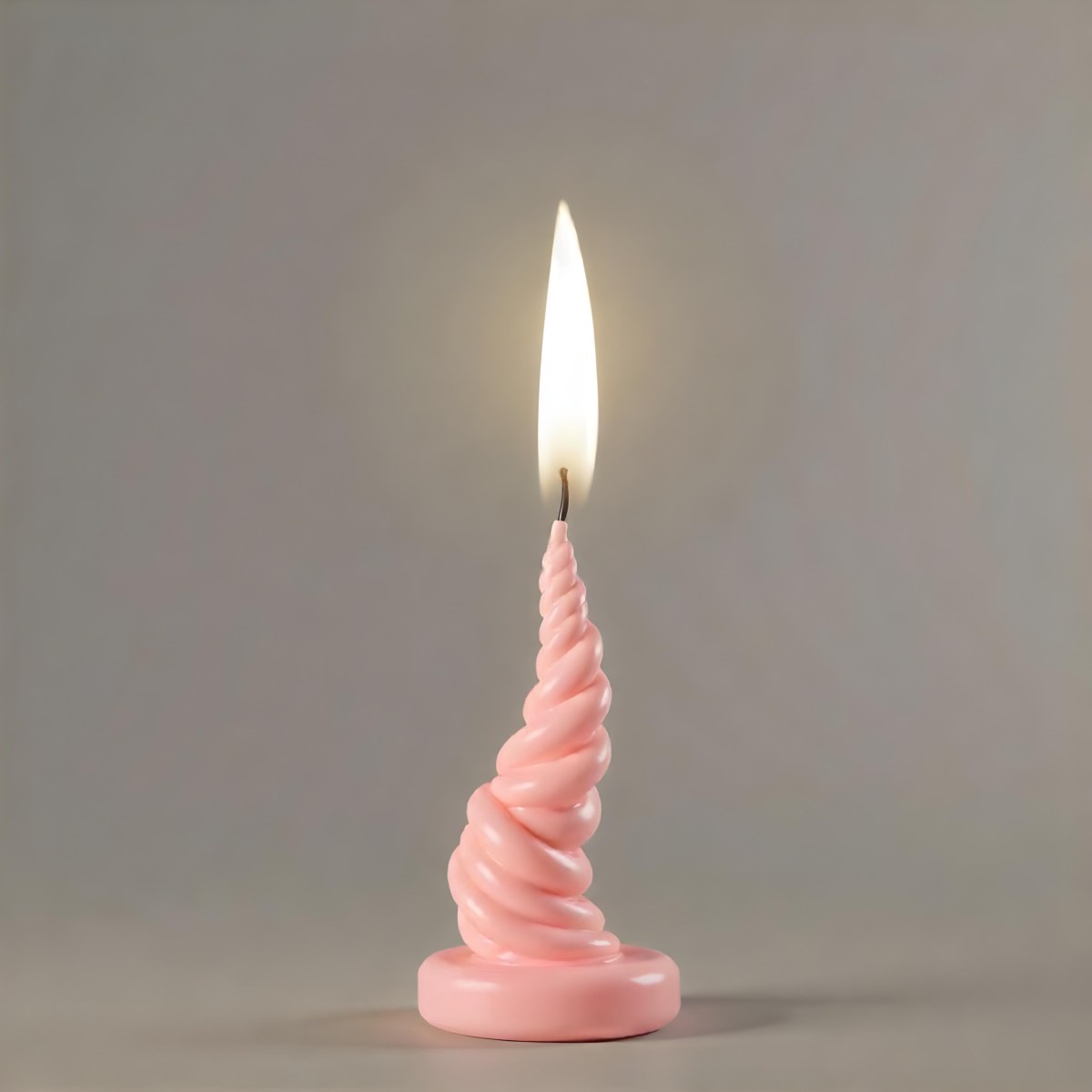A Pink Spiral Candle With A Bright Flame On Top Casting A Bright Glow Simple Gray Background 19 Ac72