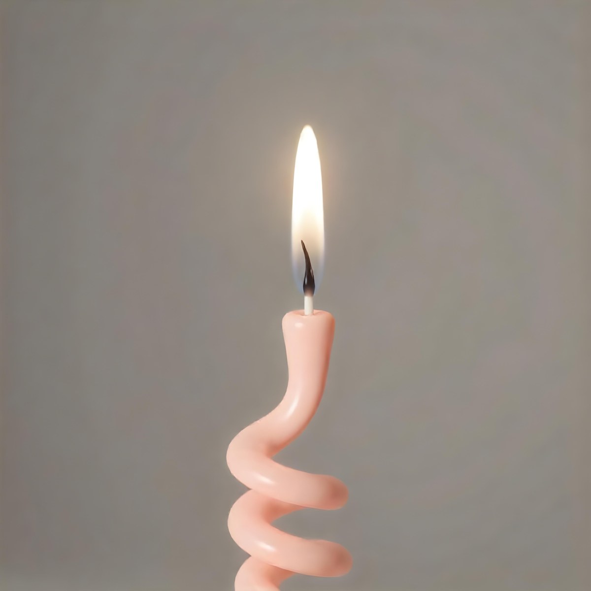 A Pink Spiral Candle With A Bright Flame On Top Casting A Bright Glow Simple Gray Background 22 270f