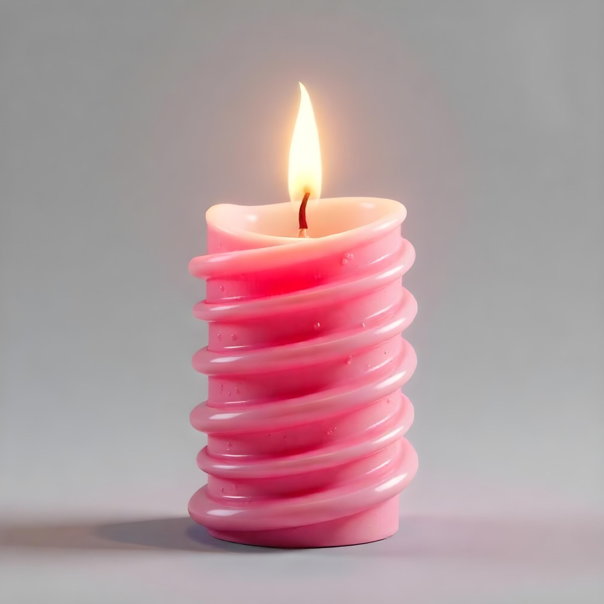A Pink Spiral Candle With A Bright Flame On Top Casting A Bright Glow Simple Gray Background 5 C322