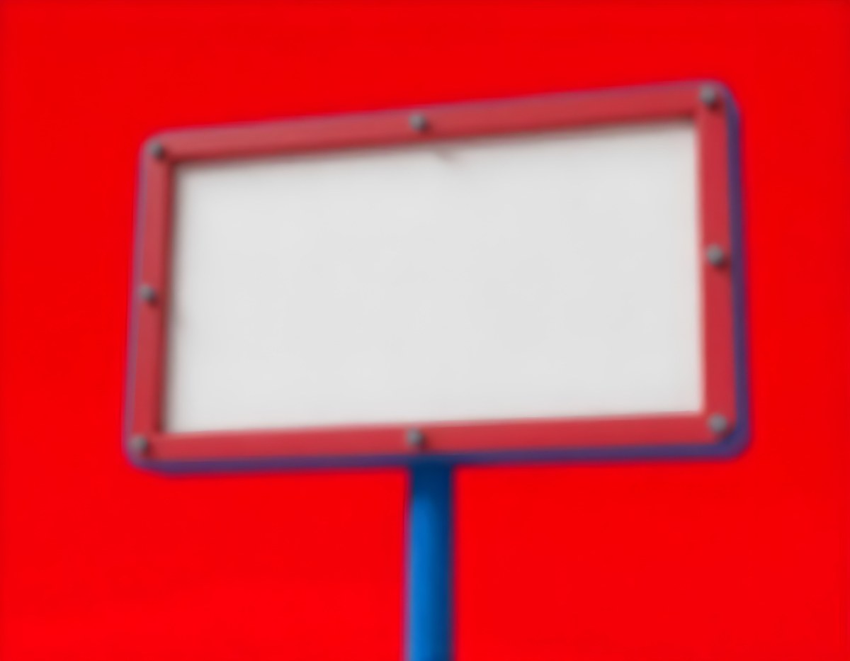 A Red And White Sign On A Pole Against A Red Sky The Sign Is Blank The Pole Is Blue 13 1a8b