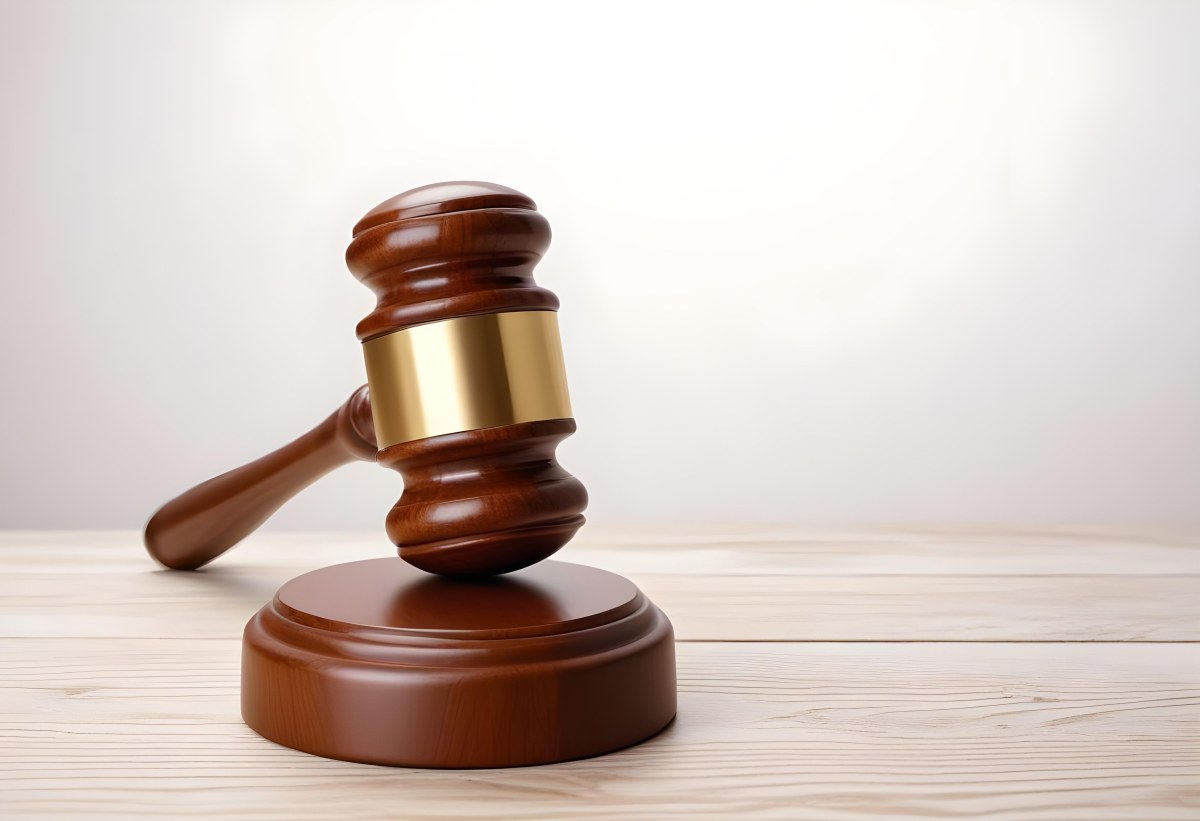 A Wooden Gavel On A Wooden Surface The Gavel Is Brown And Shiny The Background Is White And Blurred The Lighting Is Bright 5 359f