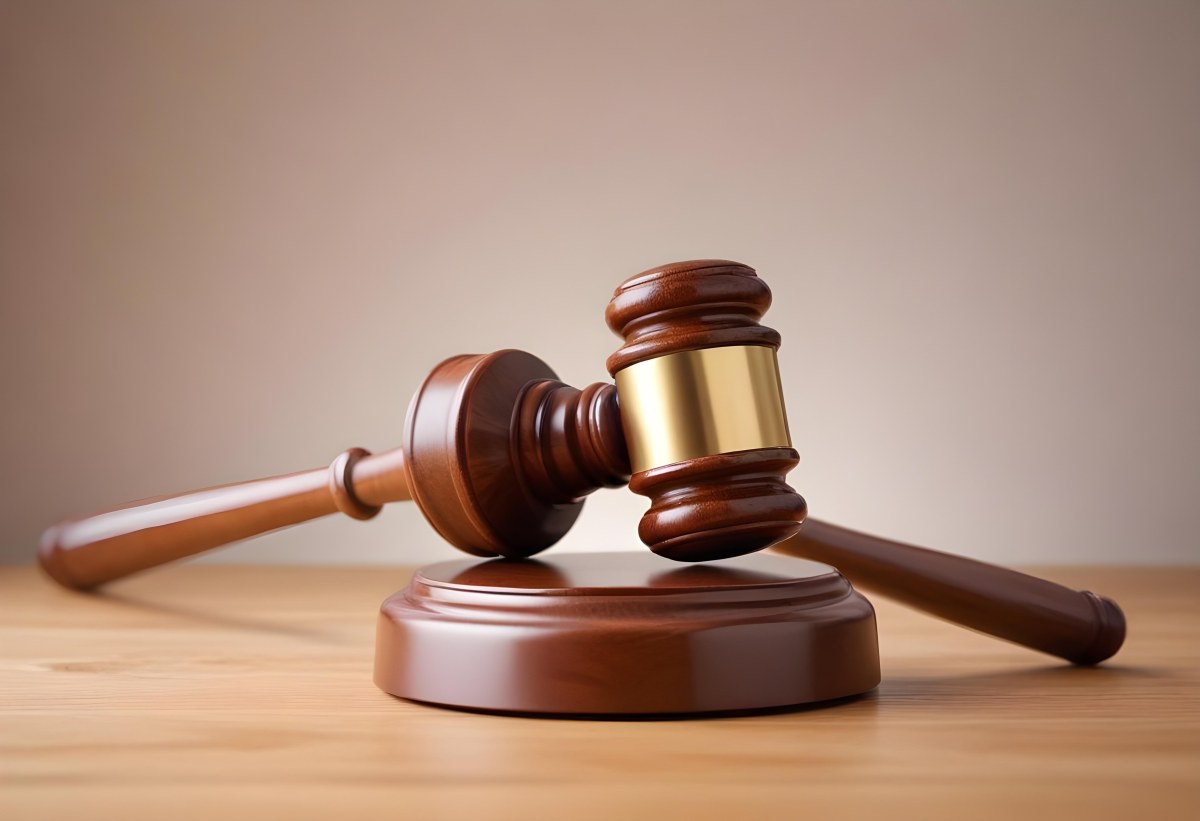 A Wooden Gavel On A Wooden Surface The Gavel Is Brown And Shiny The Background Is White And Blurred The Lighting Is Bright 6 9041