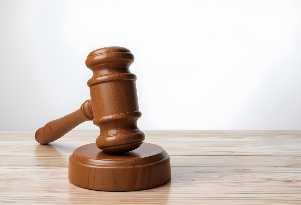 A Wooden Gavel On A Wooden Surface The Gavel Is Brown And Shiny The Background Is White And Blurred The Lighting Is Bright 8 88ba