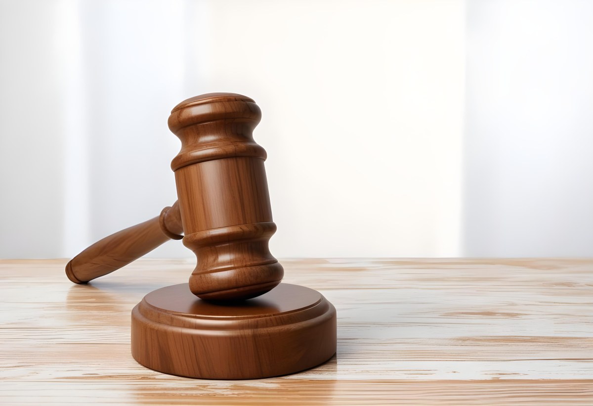 A Wooden Gavel On A Wooden Surface The Gavel Is Brown And Shiny The Background Is White And Blurred The Lighting Is Bright 9 Bdf8