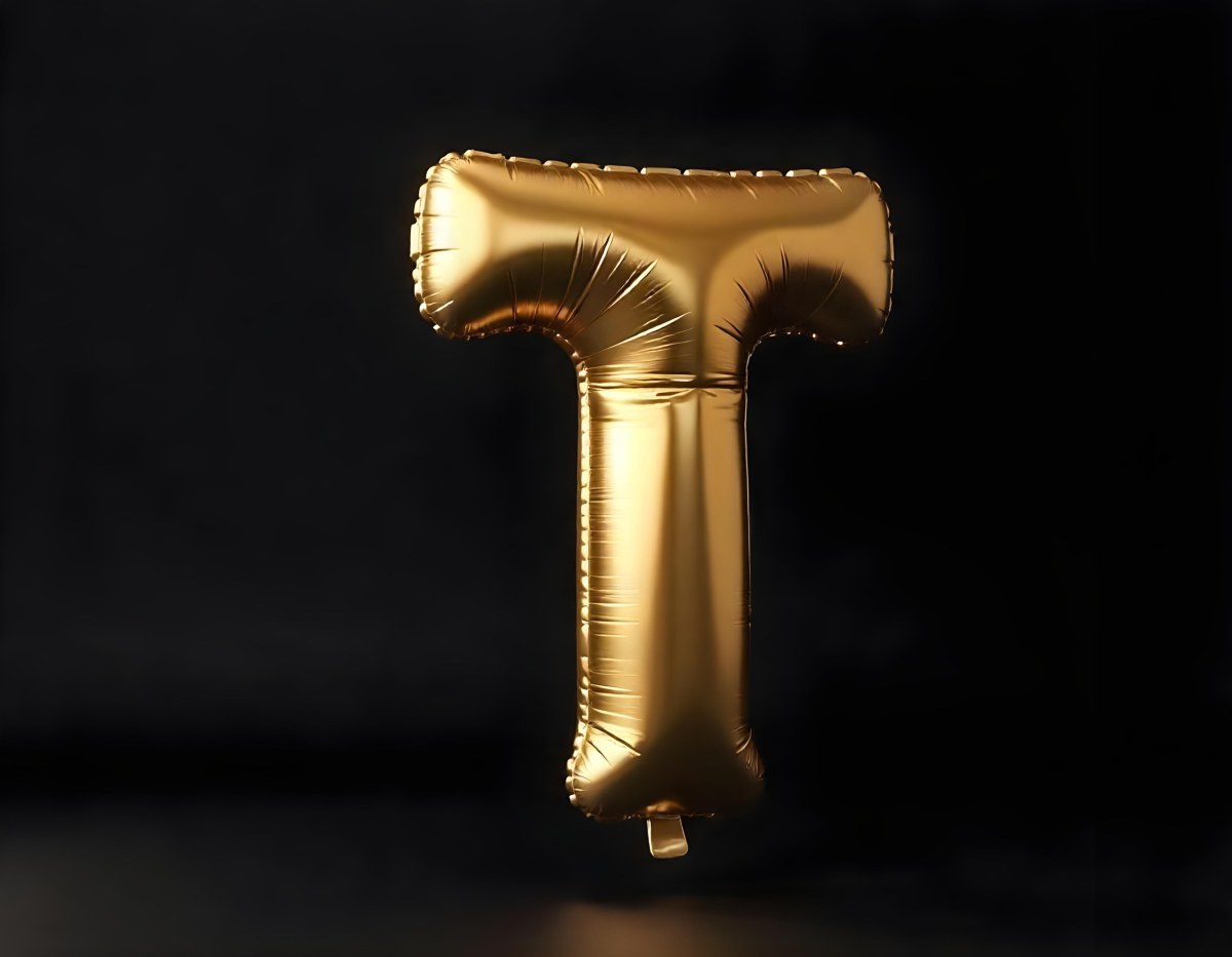 Golden Balloon Letter T Shiny And Reflective Floating In A Dark Background Casting A Soft Shadow Creating A Luxurious And Celebratory Atmosphere 18 2ec4