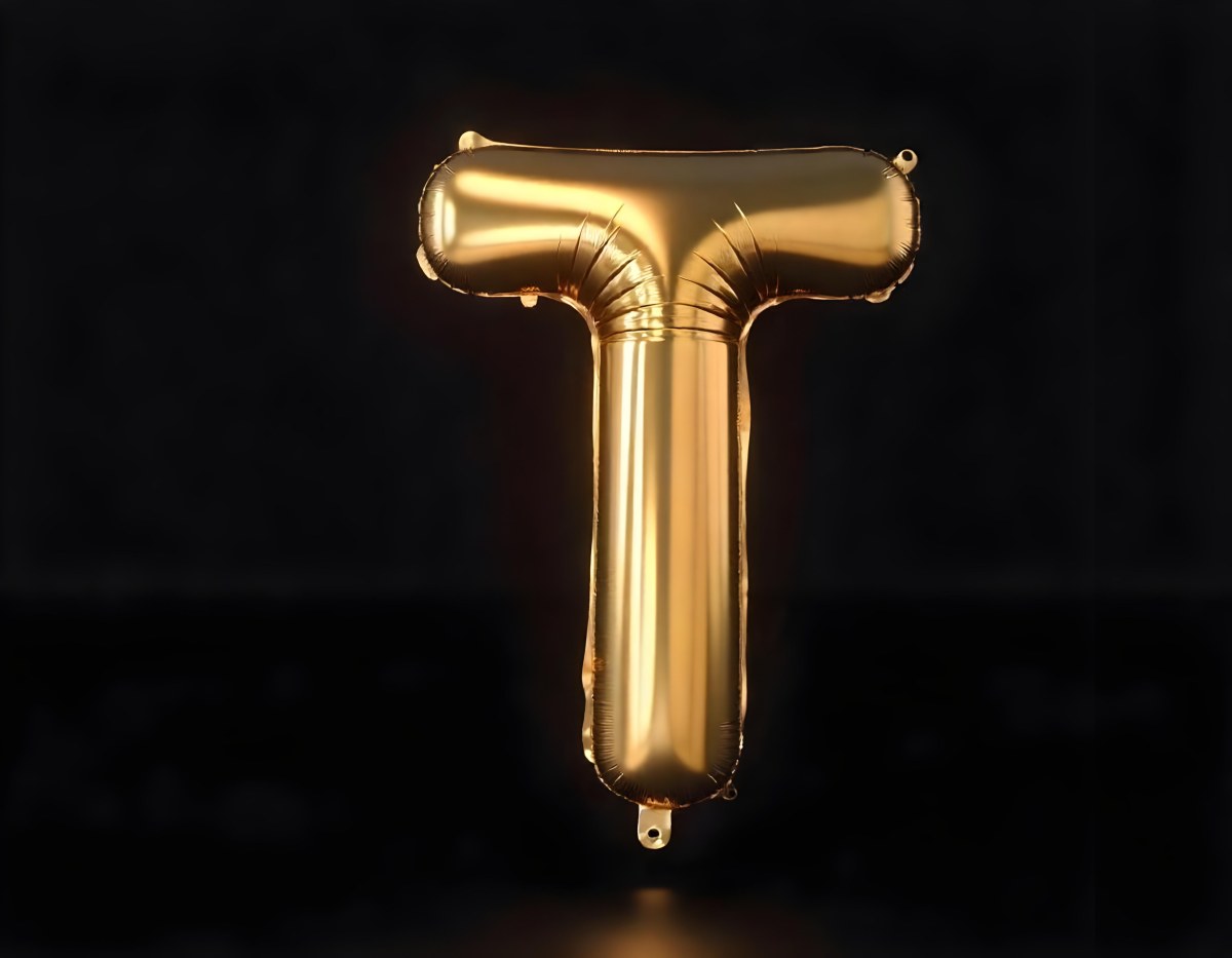 Golden Balloon Letter T Shiny And Reflective Floating In A Dark Background Casting A Soft Shadow Creating A Luxurious And Celebratory Atmosphere 6 2aa8