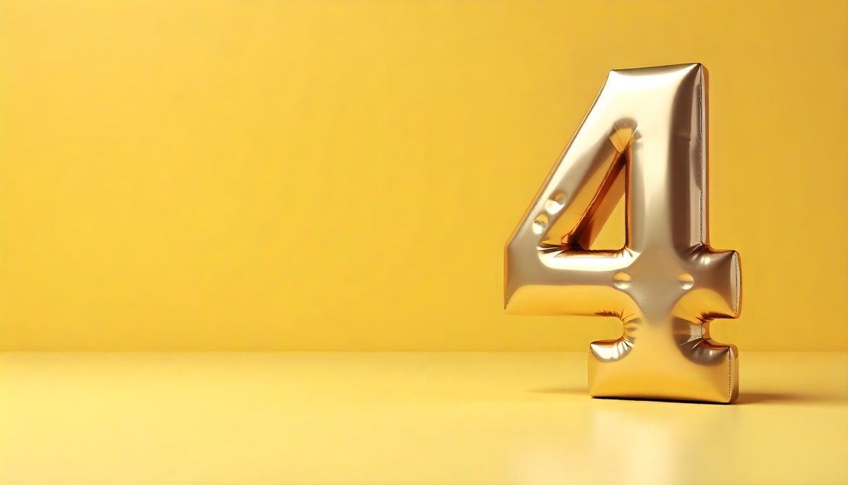 Golden Number Four With A Rough Texture Standing On A Reflective Surface With A Soft Yellow Background 17 F54e