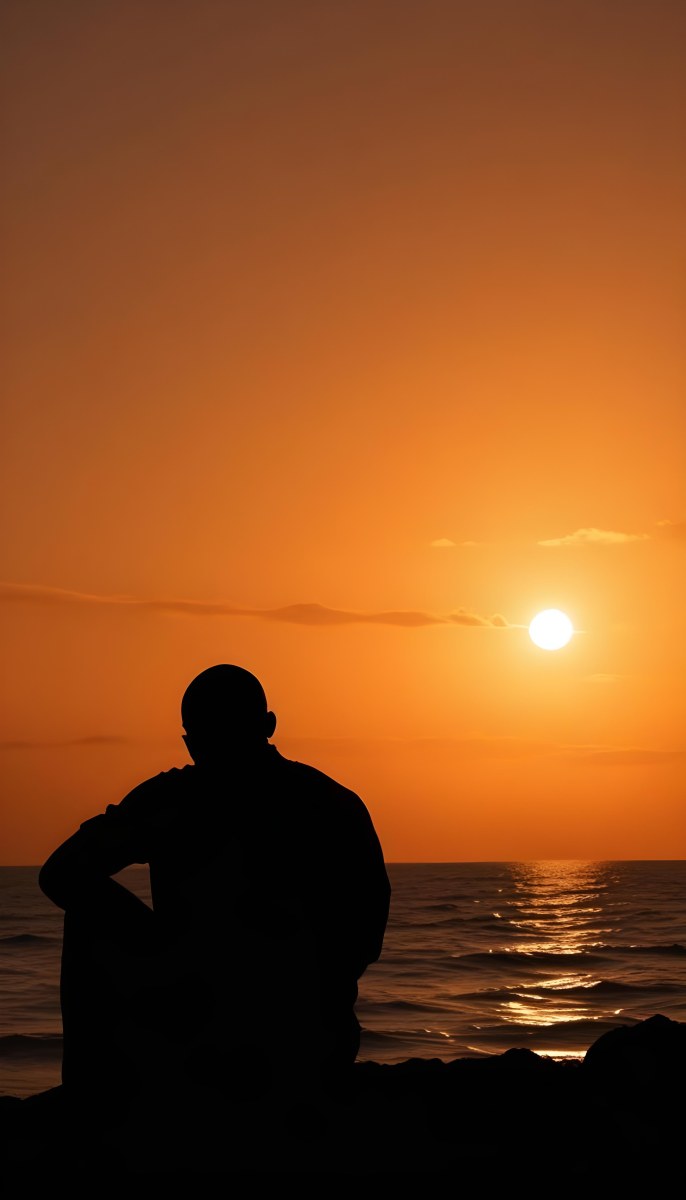 Silhouette Of A Black Man 30 Years Old Bald Contemplating The Sunset On The Beach Orange Sky Dark Ocean 6 1456