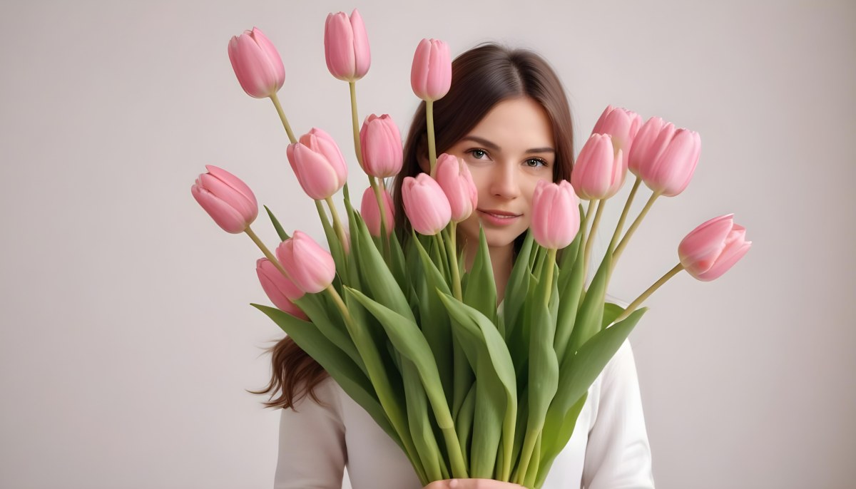 A Bouquet Of Pink Tulips In Front Of A Blurry White Woman 25 Years Old With Brown Hair In A Studio With A White Background 7 3a0b