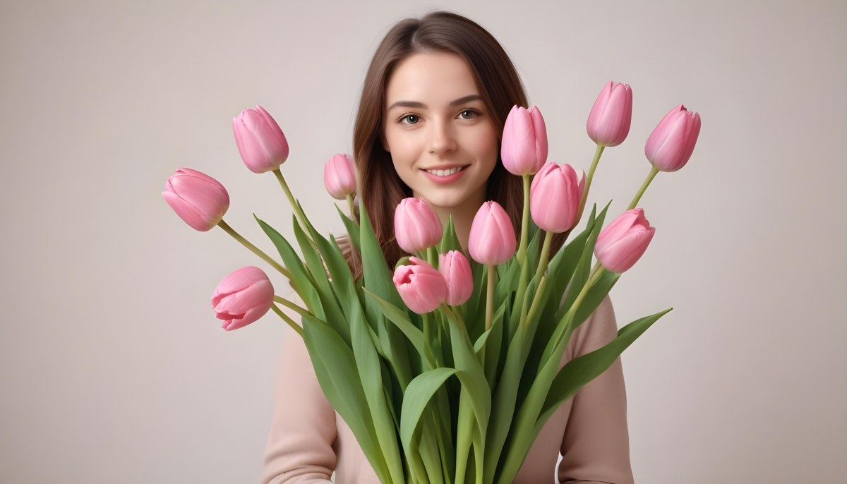 A Bouquet Of Pink Tulips In Front Of A Blurry White Woman 25 Years Old With Brown Hair In A Studio With A White Background 9 4907