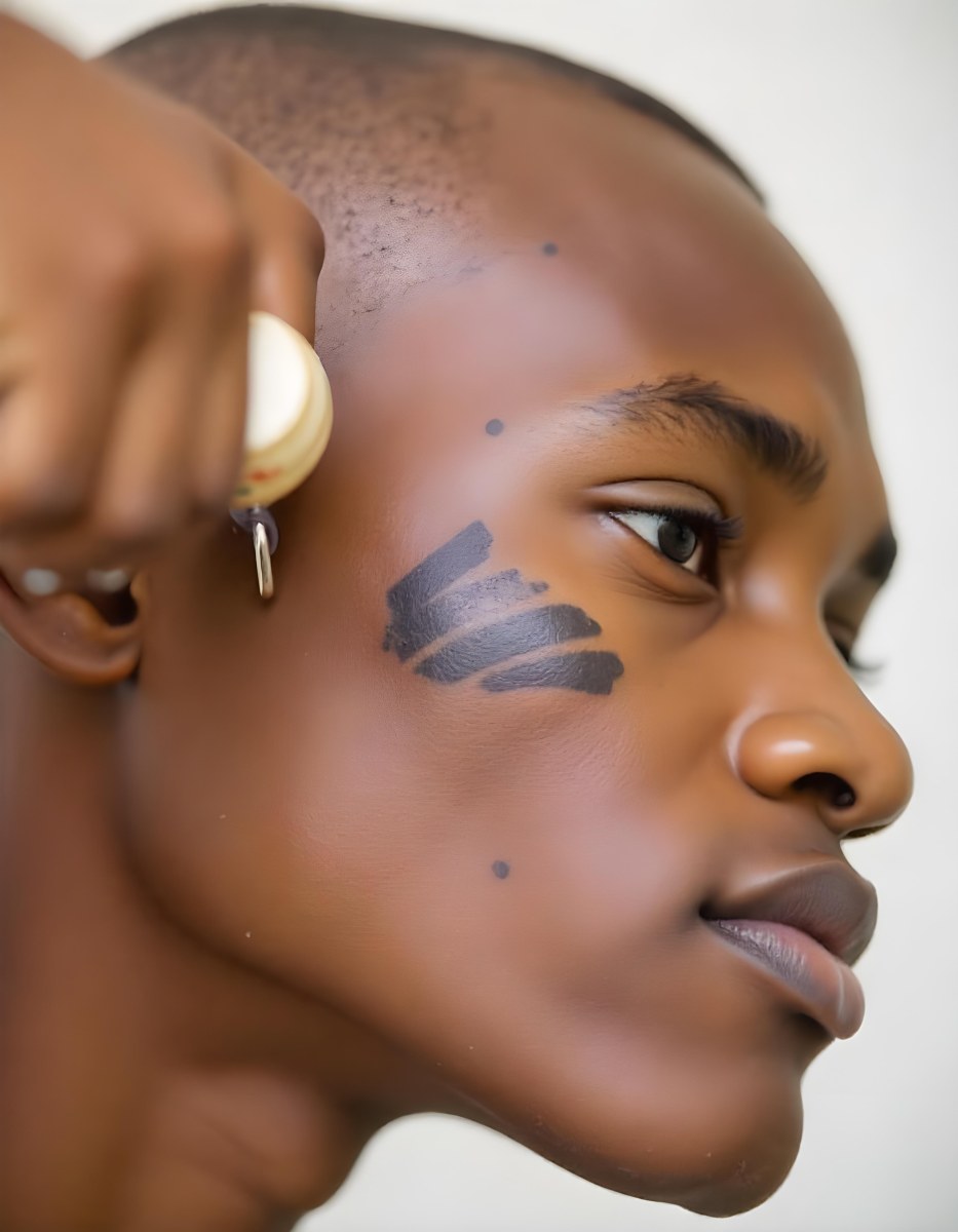 A Close Up Portrait Of A Young Black Man With A Serious Expression His Face Partially Obscured By Shadows 2 22a7