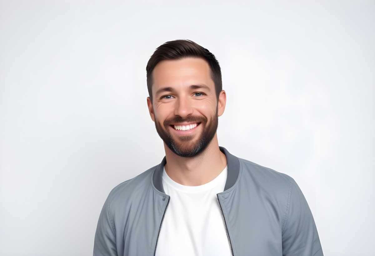 A White Man 35 Years Old With Short Dark Hair And A Beard Wearing A White T Shirt And A Gray Jacket Smiling In A White Background 7 870d