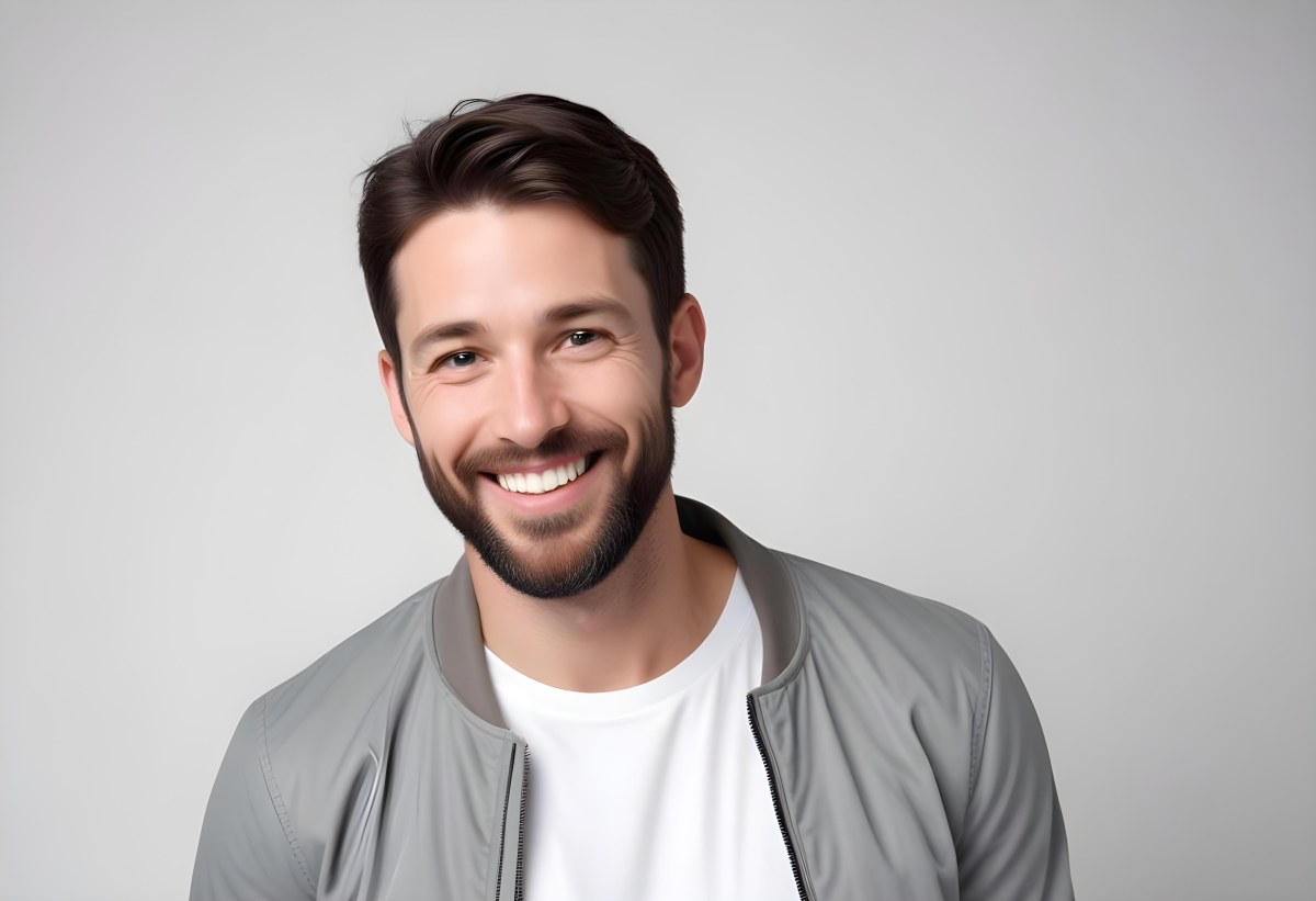 A White Man 35 Years Old With Short Dark Hair And A Beard Wearing A White T Shirt And A Gray Jacket Smiling In A White Background 8 56f1