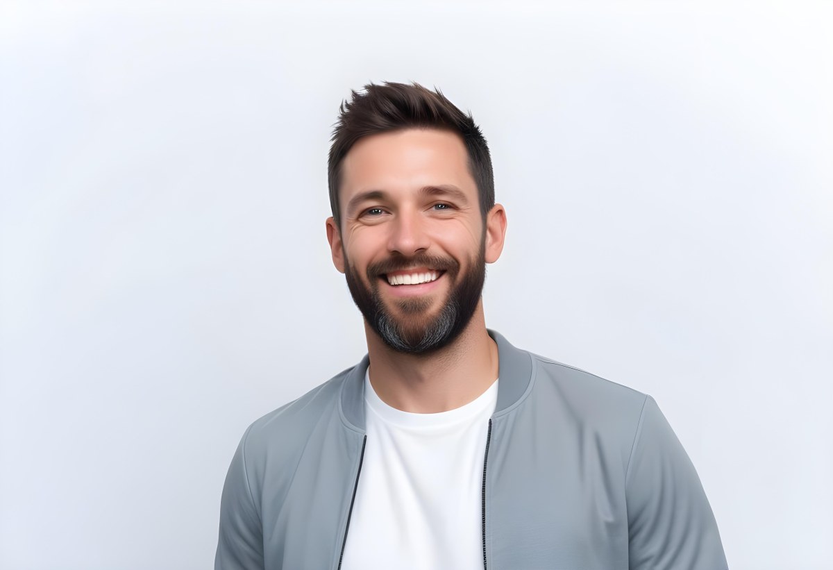 A White Man 35 Years Old With Short Dark Hair And A Beard Wearing A White T Shirt And A Gray Jacket Smiling In A White Background 9 8cbe
