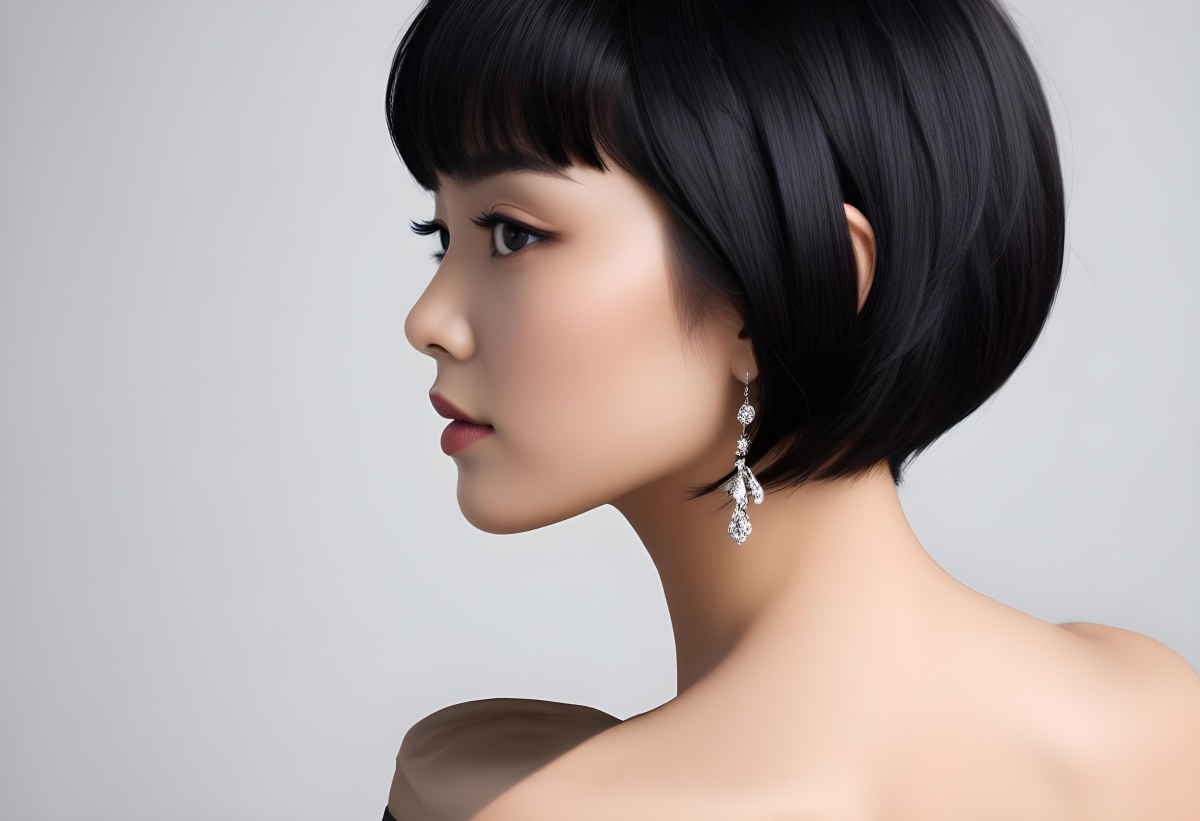 A Young Asian Woman With Short Black Hair And Pearl Earrings Looking To The Side 4 749d