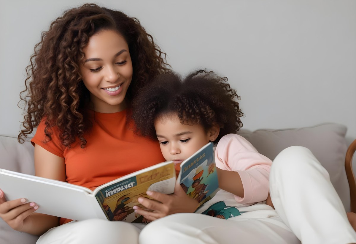 A Young Curly Haired African American Mother Reading A Book With Her Young Curly Haired African American Daughter On A Couch In A Brightly Lit Living Room 14 4de3