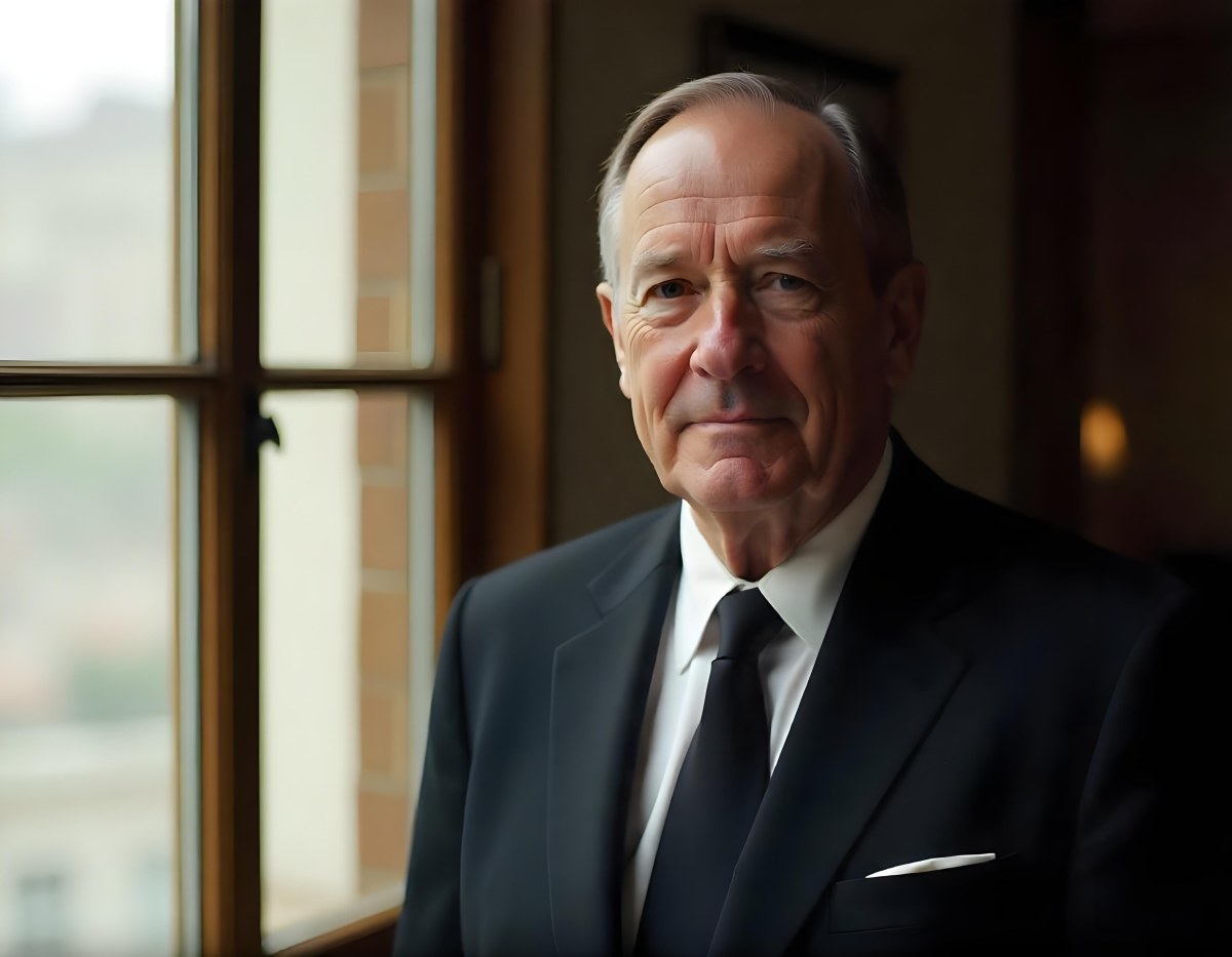 An Elderly Caucasian Man With Gray Hair Wearing A Dark Suit And Tie Standing In Front Of A Window 2 6214