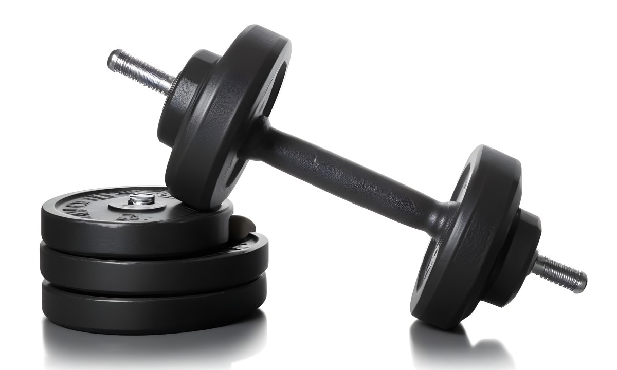 A Pair Of Black Metal Dumbbells With Weight Plates Stacked On A Dark Surface 2 3052