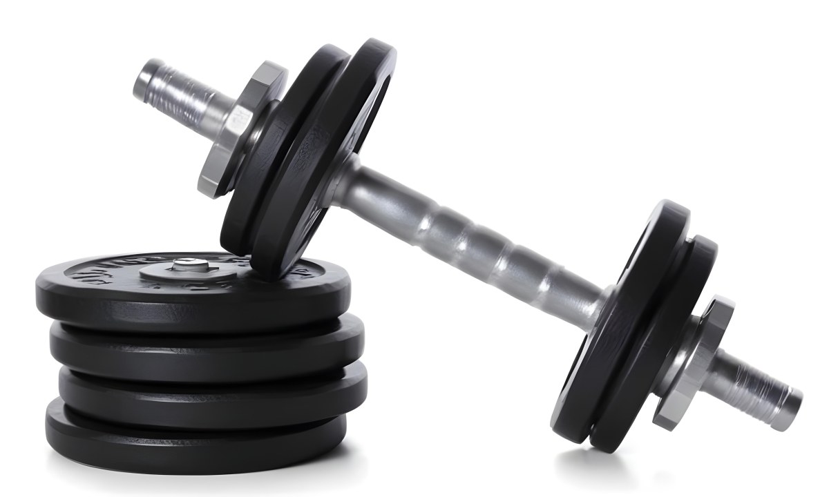 A Pair Of Black Metal Dumbbells With Weight Plates Stacked On A Dark Surface 7 8533