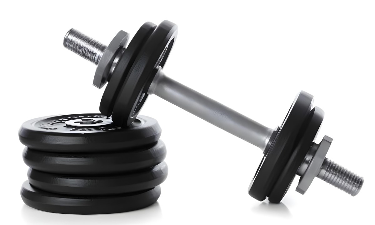 A Pair Of Black Metal Dumbbells With Weight Plates Stacked On A Dark Surface 9 9948