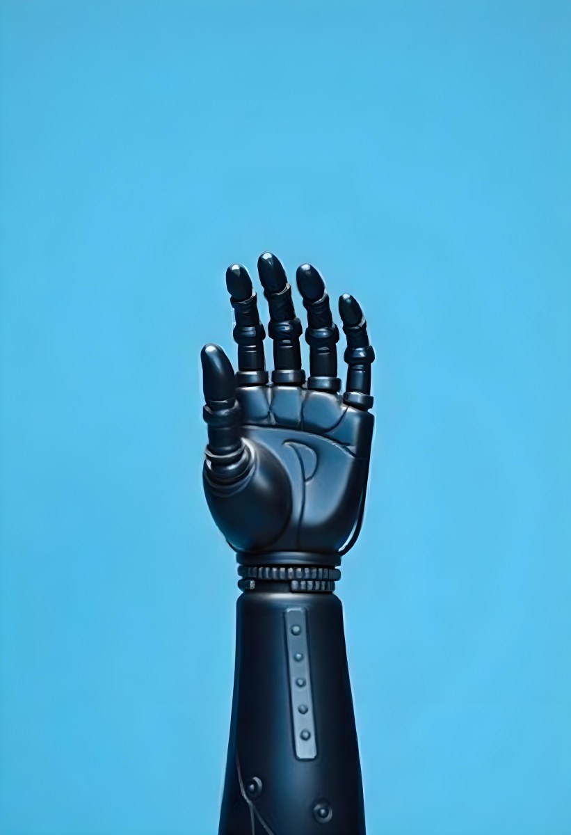 A Black Robotic Hand With Metallic Details Palm Facing Forward Fingers Slightly Curled Against A Solid Light Blue Background 14 Ea17