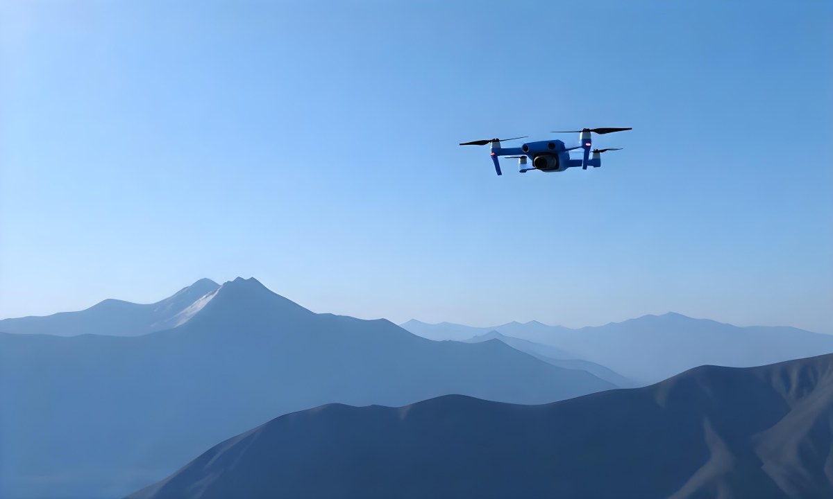 A Blue Drone Flying Over The Mountains With Mountains In The Background And A Clear Blue Sky 7 5a21