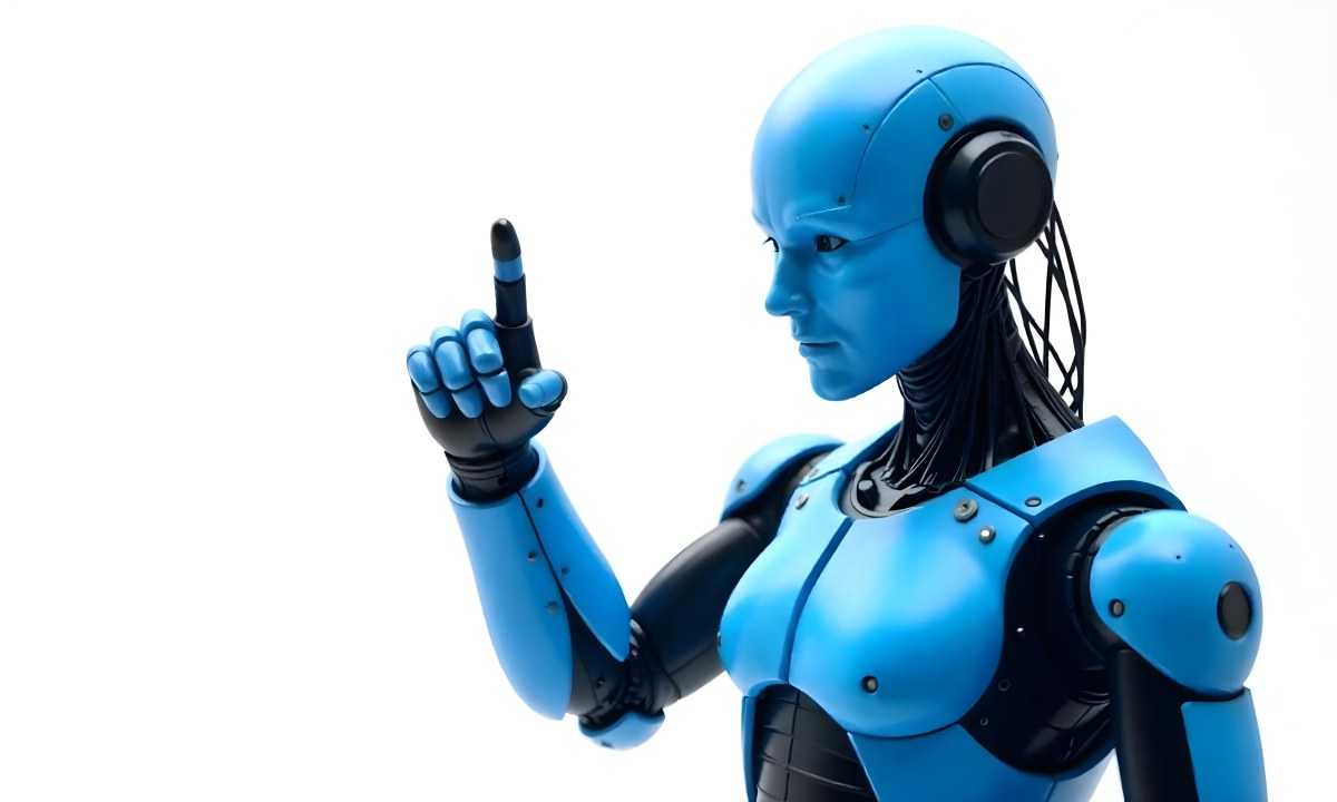 A Blue Humanoid Robot With Black Neck Cables Pointing Up With His Right Index Finger White Background 5 114a