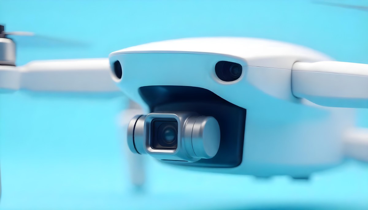 A Close Up Of A Drone Camera With A Lens And Blue Body Mounted On A White Drone With A Light Blue Background 23 0db9