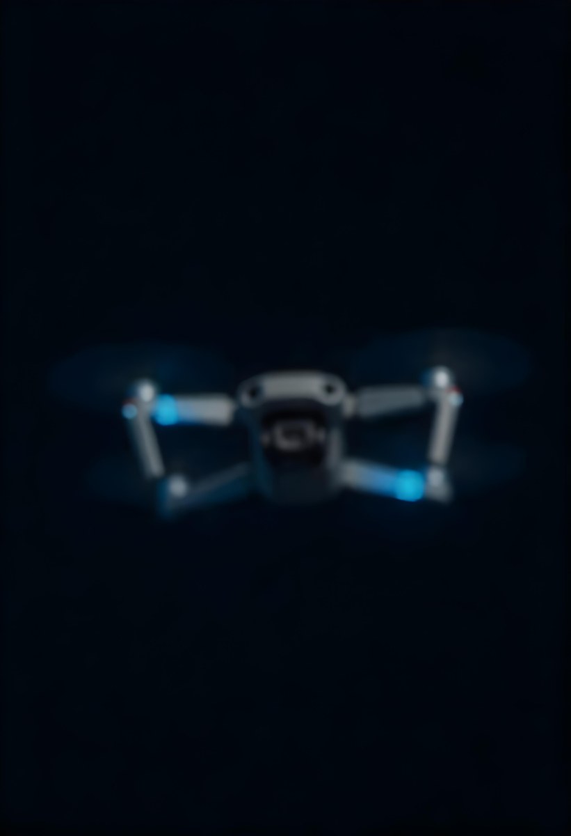 A Gray Mavic 2 Drone With Blue Propellers In The Air The Sky Is Black 5 33be