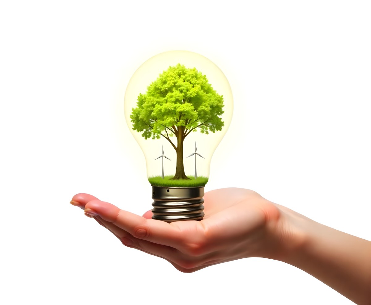 A Hand Holding A Light Bulb With A Tree And Two Windmills Inside The Background Is Plain White 61 9ca7