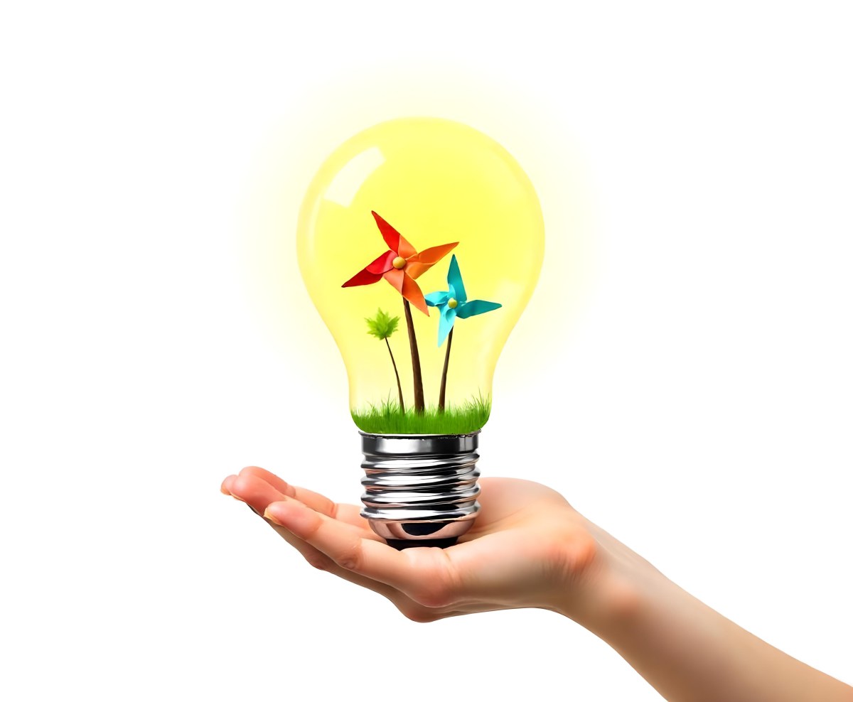 A Hand Holding A Light Bulb With A Tree And Two Windmills Inside The Background Is Plain White 80 B32f