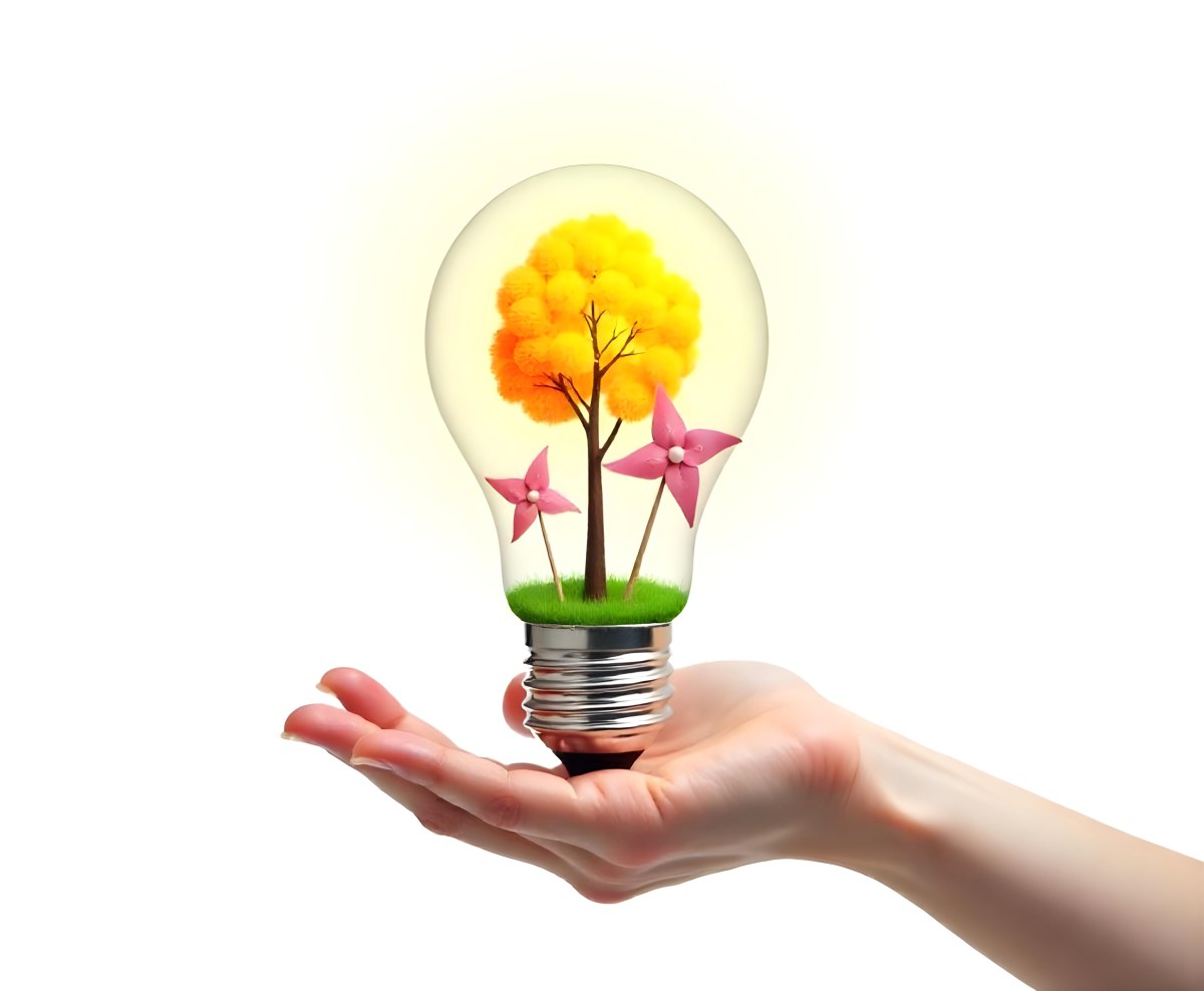 A Hand Holding A Light Bulb With A Tree And Two Windmills Inside The Background Is Plain White 96 01fa