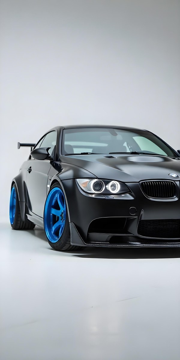 A Black Bmw M3 E92 With A Wide Body Kit Blue Rims And A Carbon Fiber Front Lip Studio Background 26 0e86