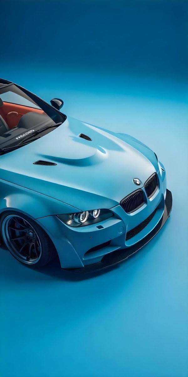 A Black Bmw M3 E92 With A Wide Body Kit Blue Rims And A Carbon Fiber Front Lip Studio Background 4 C866