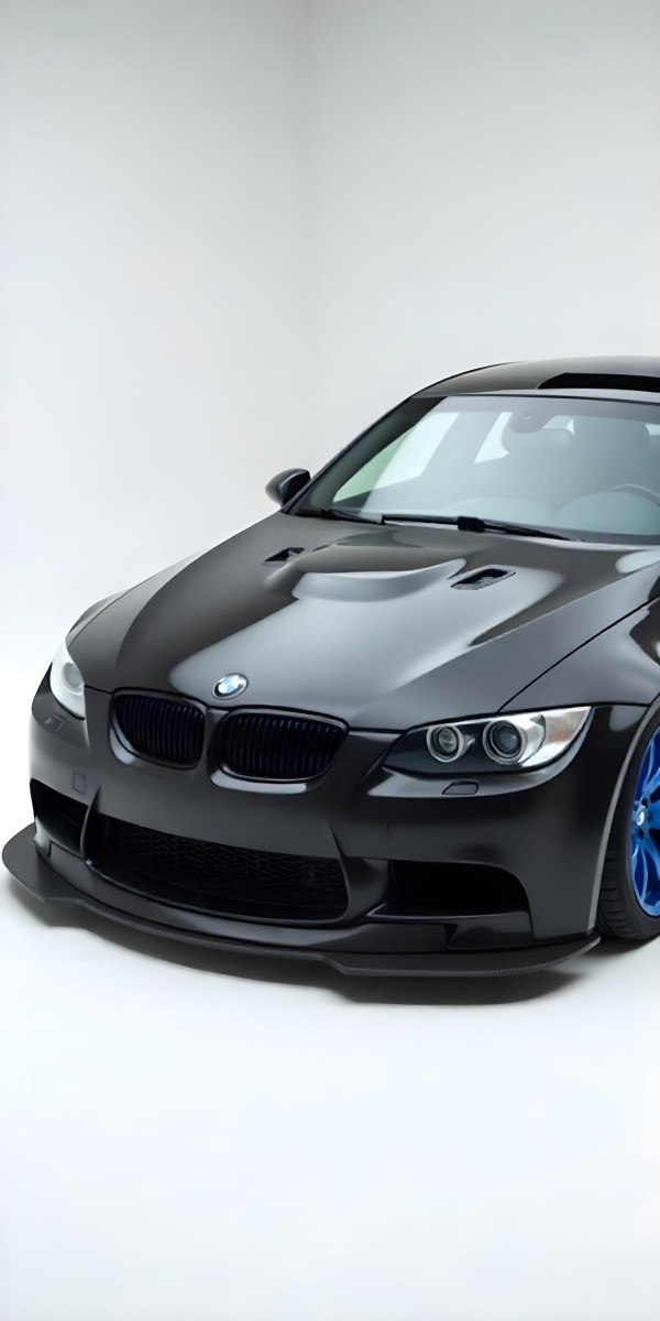 A Black Bmw M3 E92 With A Wide Body Kit Blue Rims And A Carbon Fiber Front Lip Studio Background 5 F579