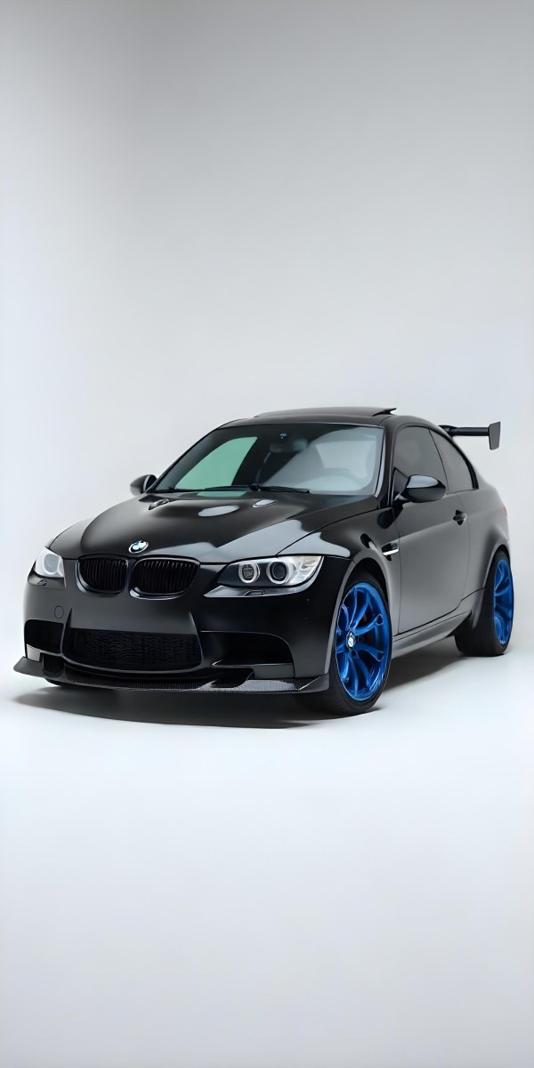 A Black Bmw M3 E92 With A Wide Body Kit Blue Rims And A Carbon Fiber Front Lip Studio Background 7 964b
