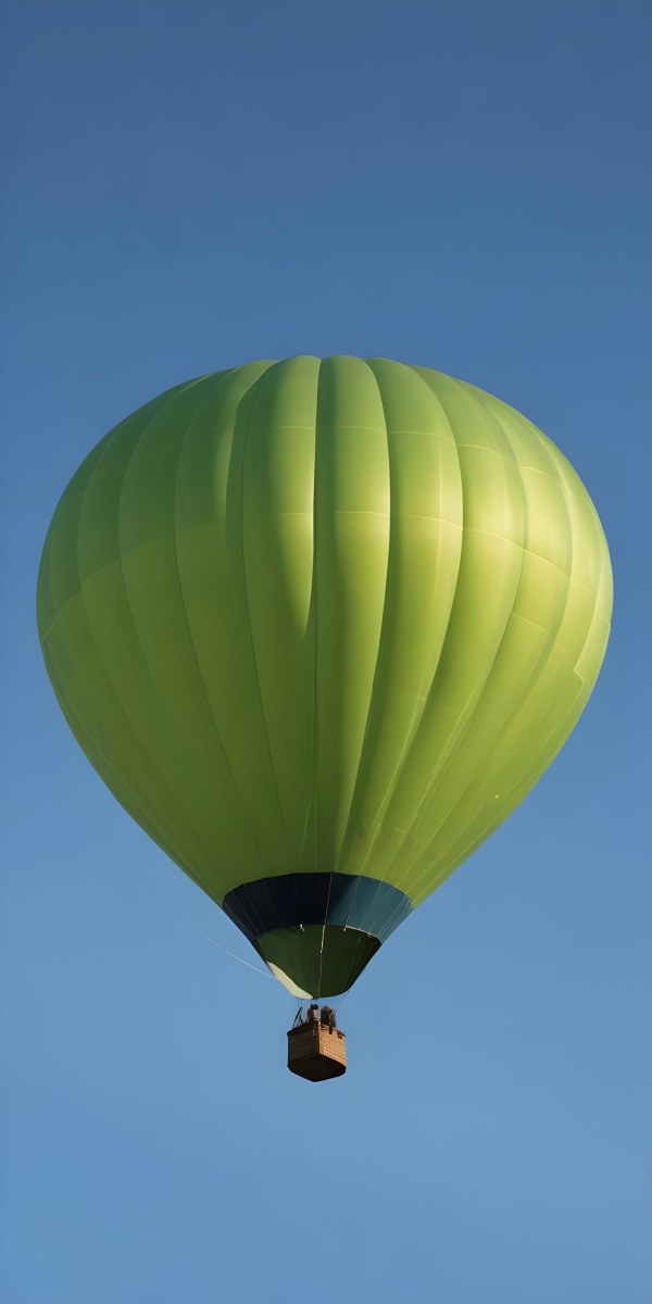A Blue Hot Air Balloon With A Blue Base Against A Clear Blue Sky The Balloon Is Brightly Lit And Appears To Be Floating 37 662f