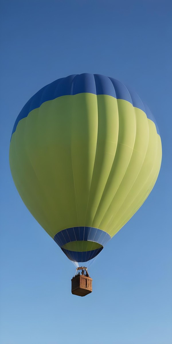 A Blue Hot Air Balloon With A Blue Base Against A Clear Blue Sky The Balloon Is Brightly Lit And Appears To Be Floating 6 5446