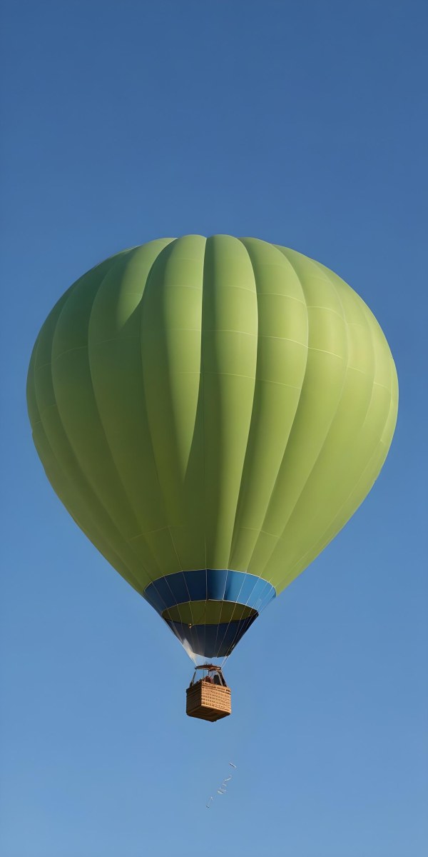 A Blue Hot Air Balloon With A Blue Base Against A Clear Blue Sky The Balloon Is Brightly Lit And Appears To Be Floating 8 2d3c
