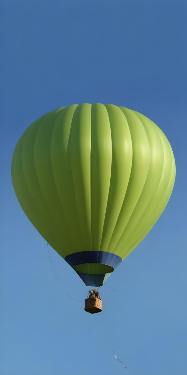 A Blue Hot Air Balloon With A Blue Base Against A Clear Blue Sky The Balloon Is Brightly Lit And Appears To Be Floating 9 247c