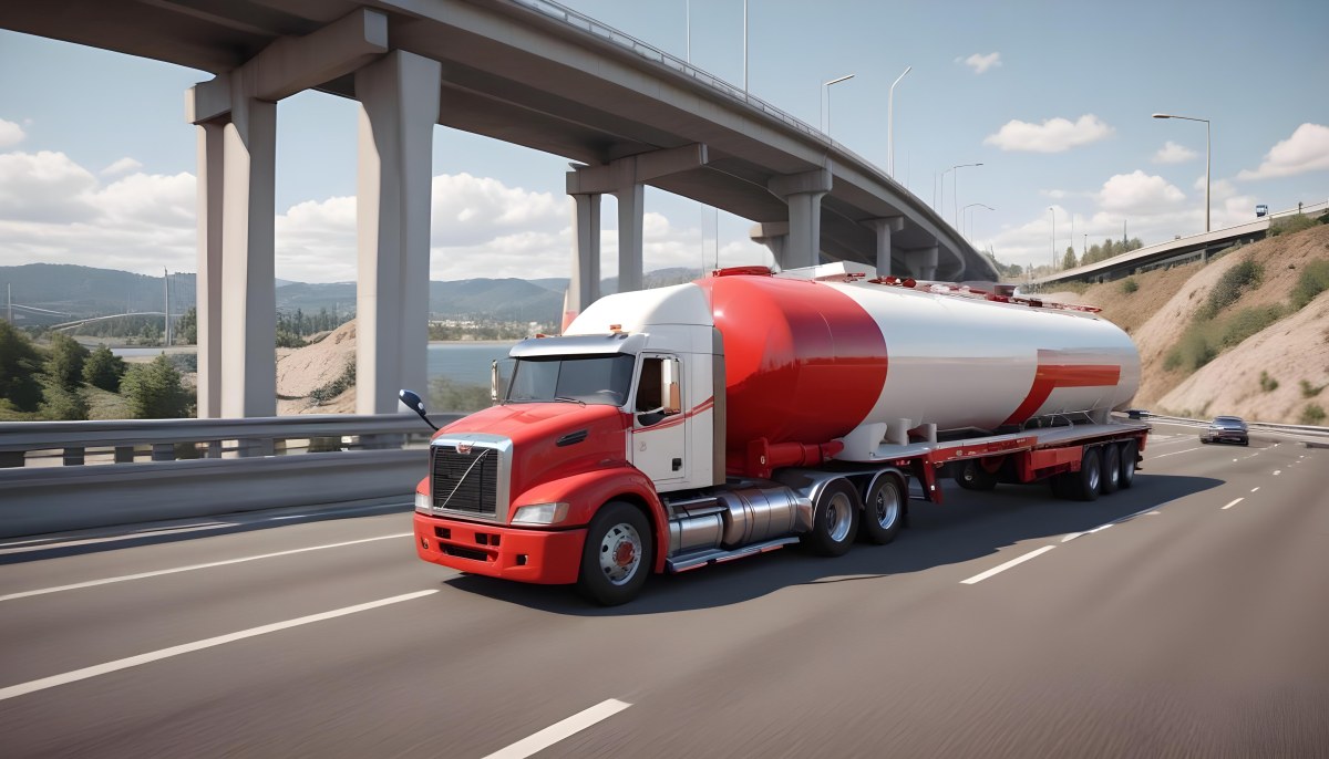 A Long Silver Truck On The Road The Trailer Is Reflective Like A Mirror Sunset Sky In The Background 87 6825