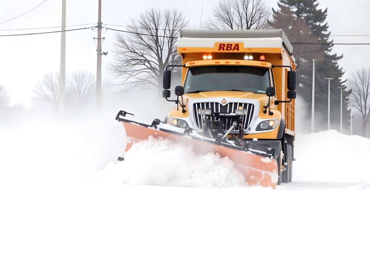 A Yellow Snowplow Truck Plowing Snow On A Road The Background Is A Snowy Landscape With Trees And Power Lines 11 6072
