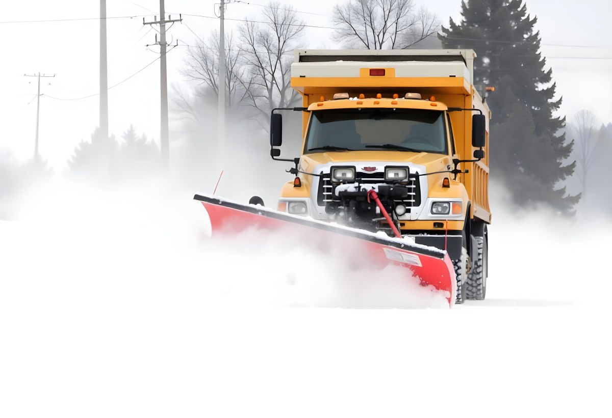 A Yellow Snowplow Truck Plowing Snow On A Road The Background Is A Snowy Landscape With Trees And Power Lines 9 724e