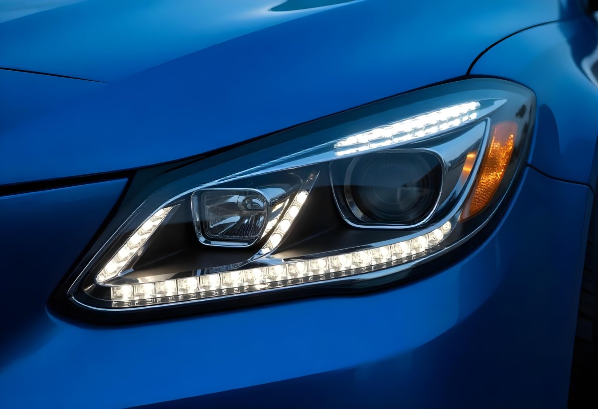 Car Headlight With Chrome Trim And Led Lights Blue Car Paint In The Background Close Up Shot 17 8d1e