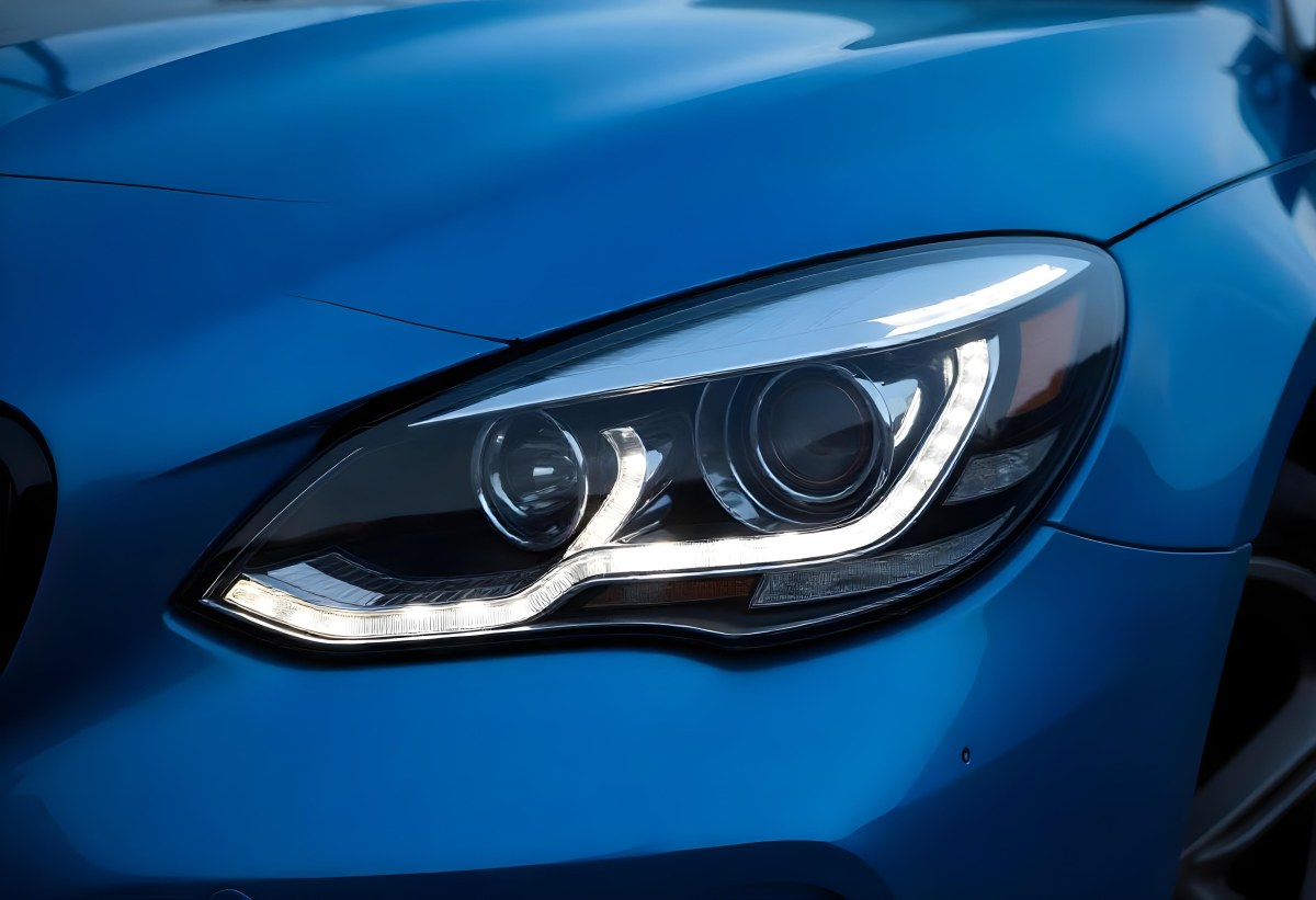 Car Headlight With Chrome Trim And Led Lights Blue Car Paint In The Background Close Up Shot 41 05ec
