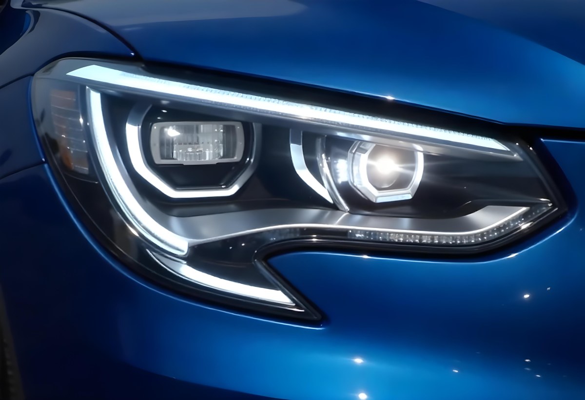 Car Headlight With Chrome Trim And Led Lights Blue Car Paint In The Background Close Up Shot 55 3b31