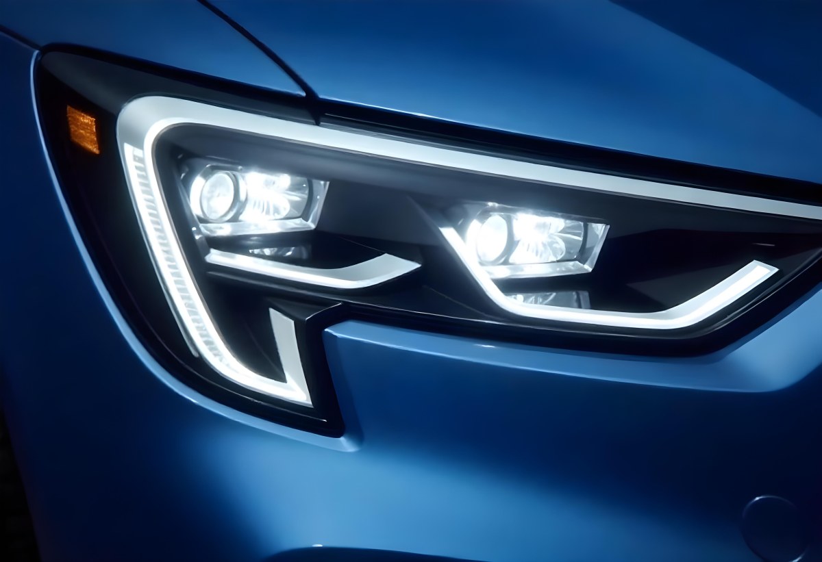 Car Headlight With Chrome Trim And Led Lights Blue Car Paint In The Background Close Up Shot 6 4431