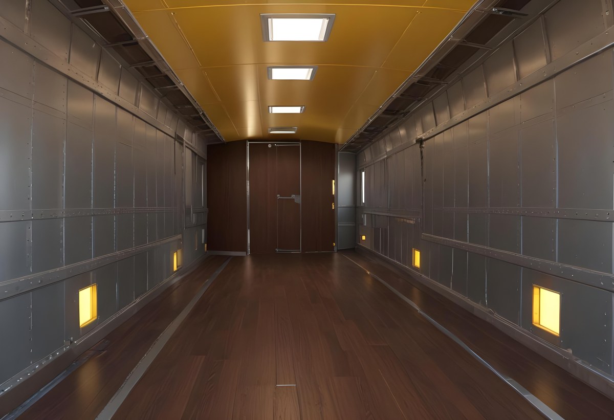 Inside Of An Empty Semi Truck Trailer With Brown Floor And Metal Walls Yellow Ceiling Wooden Door At The End 18 0cd2