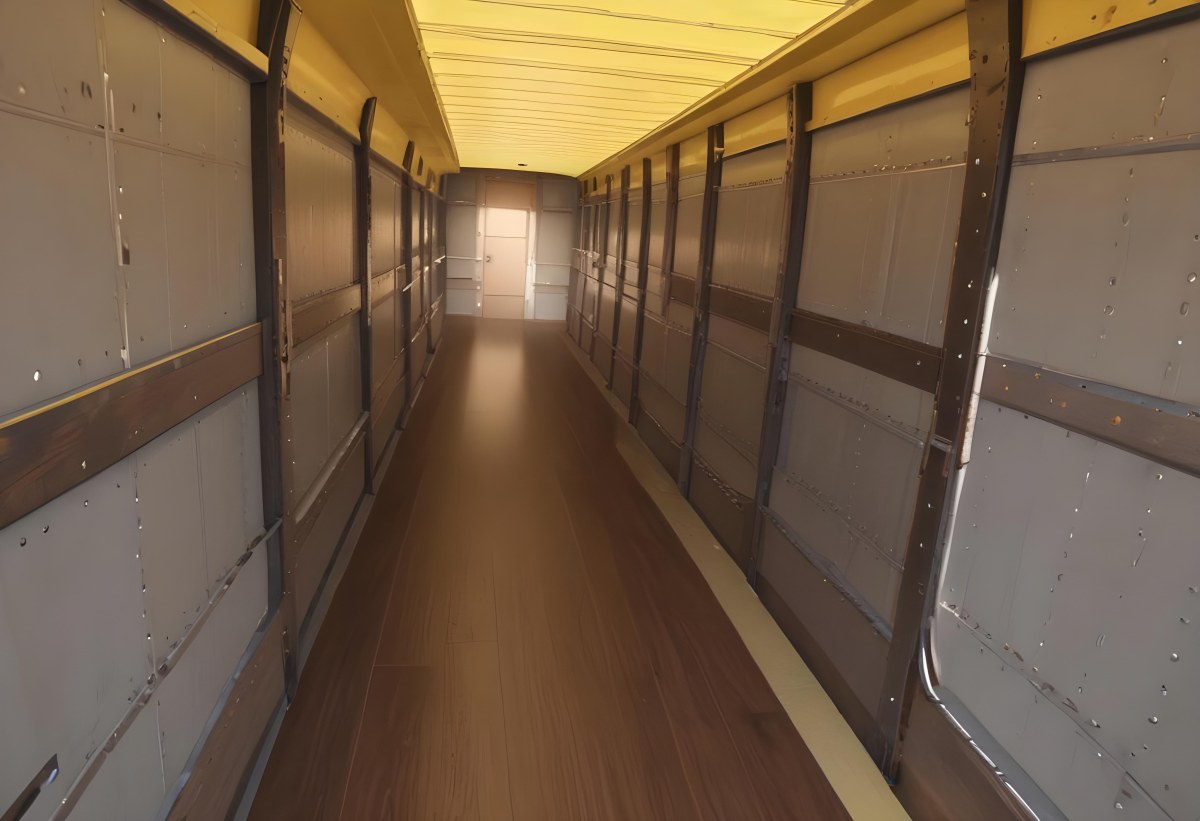 Inside Of An Empty Semi Truck Trailer With Brown Floor And Metal Walls Yellow Ceiling Wooden Door At The End 2 E5ed